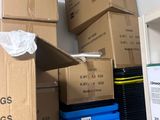 many boxes stacked on a shelf in a room