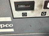 a close up of a machine that has a clock on it