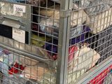 a large metal cage with many items in it