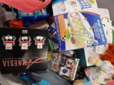 a pile of assorted toys and other items on a table