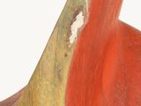 a red and yellow sculpture of a bird on a white surface