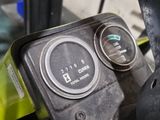 a close up of a yellow and black motorcycle with two gauges