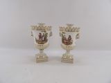 pair of antique porcelain vases with painted scenes on them