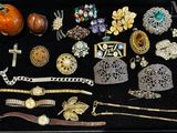 many different types of jewelry displayed in a display case