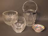 three glasses and a bowl sitting on a table