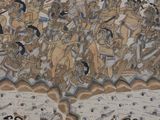 a painting on the wall of a building with a lot of people on it