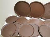 a lot of brown plates and pans on a table
