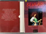 a red book with a picture of a woman in a green dress