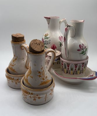 three vases and two cups on the table