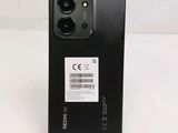 the back of a black phone with a barcode sticker on it