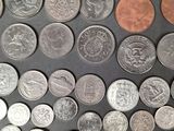 a lot of coins that are on the table