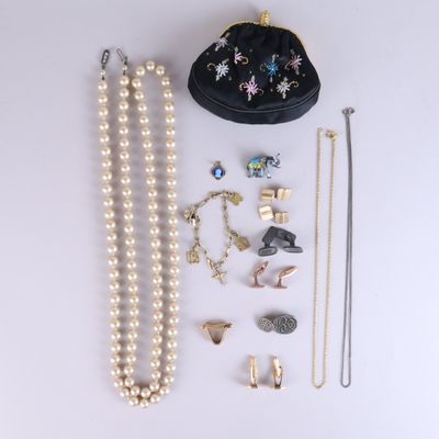 an assortment of jewelry including a purse, necklaces, and earrings