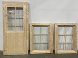 three wooden doors and a window in a room