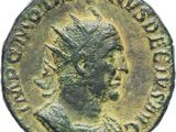 an ancient roman coin with a head of a man wearing a crown