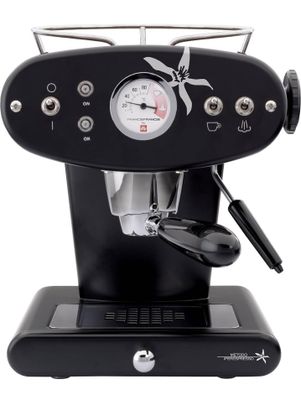 the coffee machine is black and has a clock on it