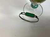 a glass of water and a cell phone sitting on a table