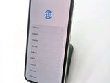 a phone that is sitting on top of a stand