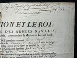 an old document with writing on it on a black background