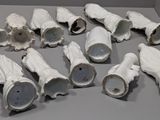 a lot of white gloves that are sitting on a table