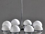 an image of a chandelier with six eggs hanging from it