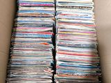 a box filled with lots of magazines sitting on top of a table