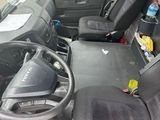 a view of the inside of a bus from the driver ' s seat
