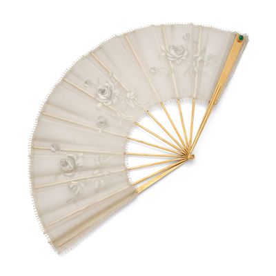 a close up of a white fan on a white surface