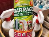 un gros plan sur une bouteille de Barrage posée sur une table