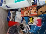 a bag full of items that are sitting in a trash can