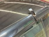 a close up of a metal object on the roof of a car