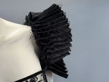 a close up of a mannequin dress with black lace on it