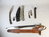 many different types of knives and knives on the table