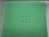 a green piece of paper with the letter e on it
