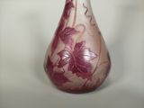 a vase with a red and white design on it