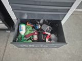 a trash can that has a lot of items inside of it