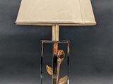 an image of a lamp with a glass base and a lamp shade on it