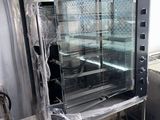 a commercial oven with a glass door in a commercial kitchen