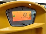 a close up of the dashboard of a yellow motorcycle