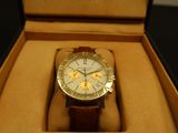 a watch that is in a box on the table