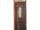 an old door with a glass window on it