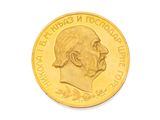 l'image d'une pièce d'or sur laquelle figure le portrait d'un homme