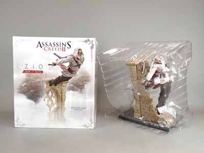 two figurines of a man on top of a tower