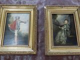 two framed paintings of a man and a woman on a marble floor