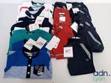 a lot of clothes that are sitting on a table