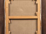 an old wooden frame with a picture hanging on the wall
