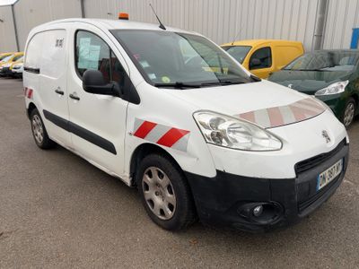 a white van parked in a parking lot next to other cars