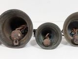three vases sitting next to each other on a table
