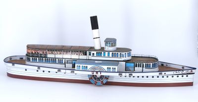 a paper model of a steam ship on a white background