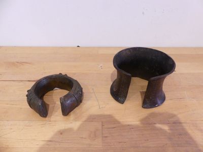 two pieces of wood sitting on a table next to each other