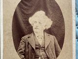 an old photo of a man in a suit and tie
